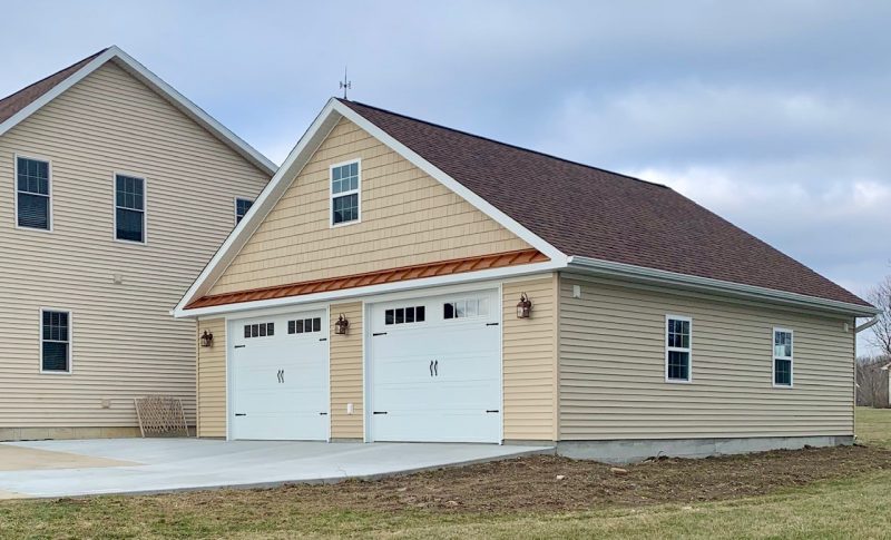 tan detached two car garage