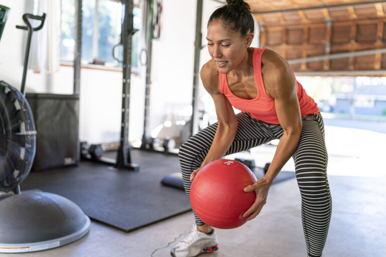 woman-working-out-in-garage-gym