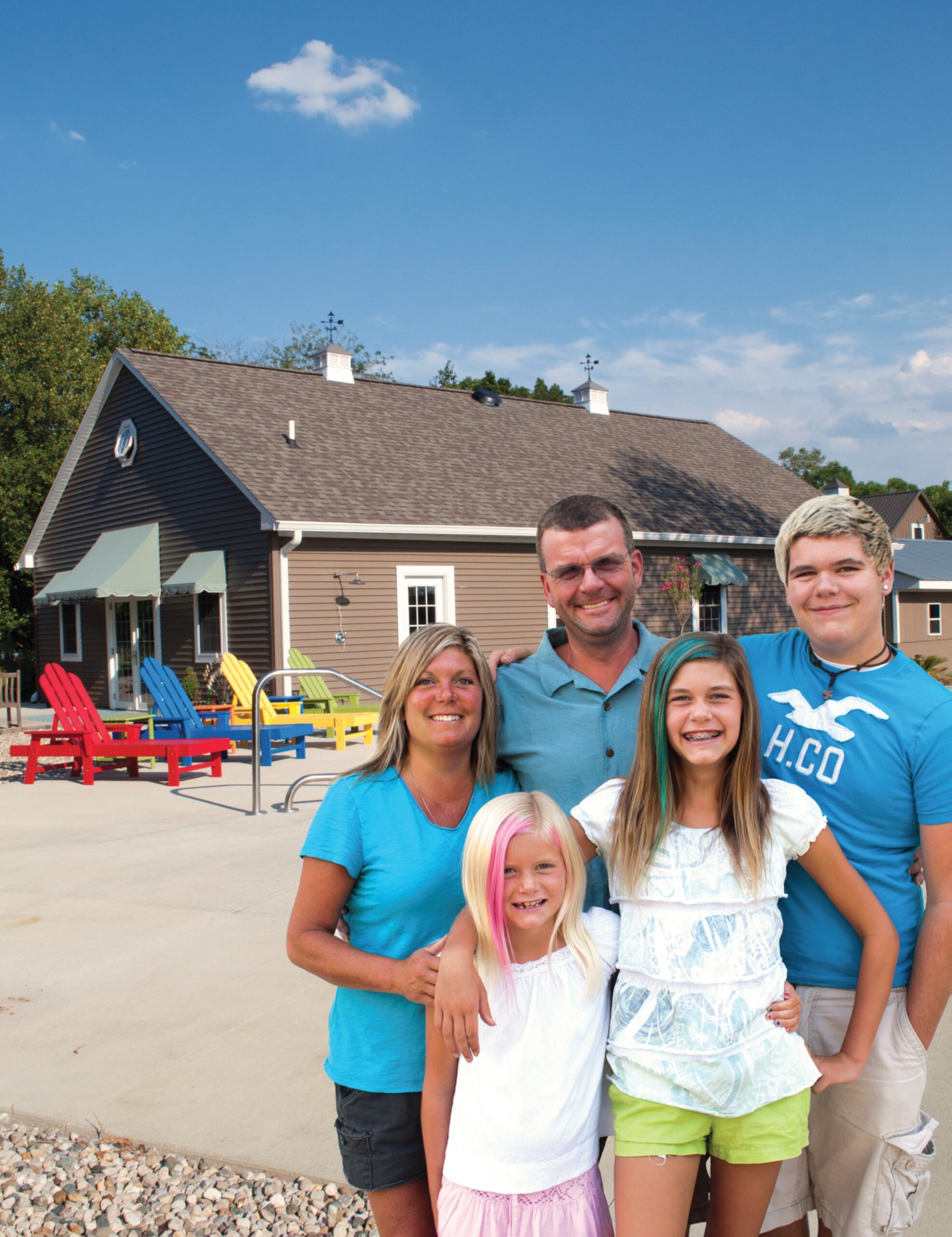 fortune-family-in-front-of-their-coach-house-garage