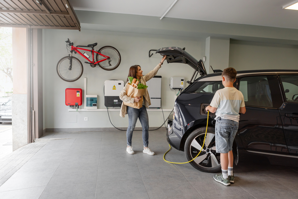 Family-with-EV-charging-for-car-in-new-garage