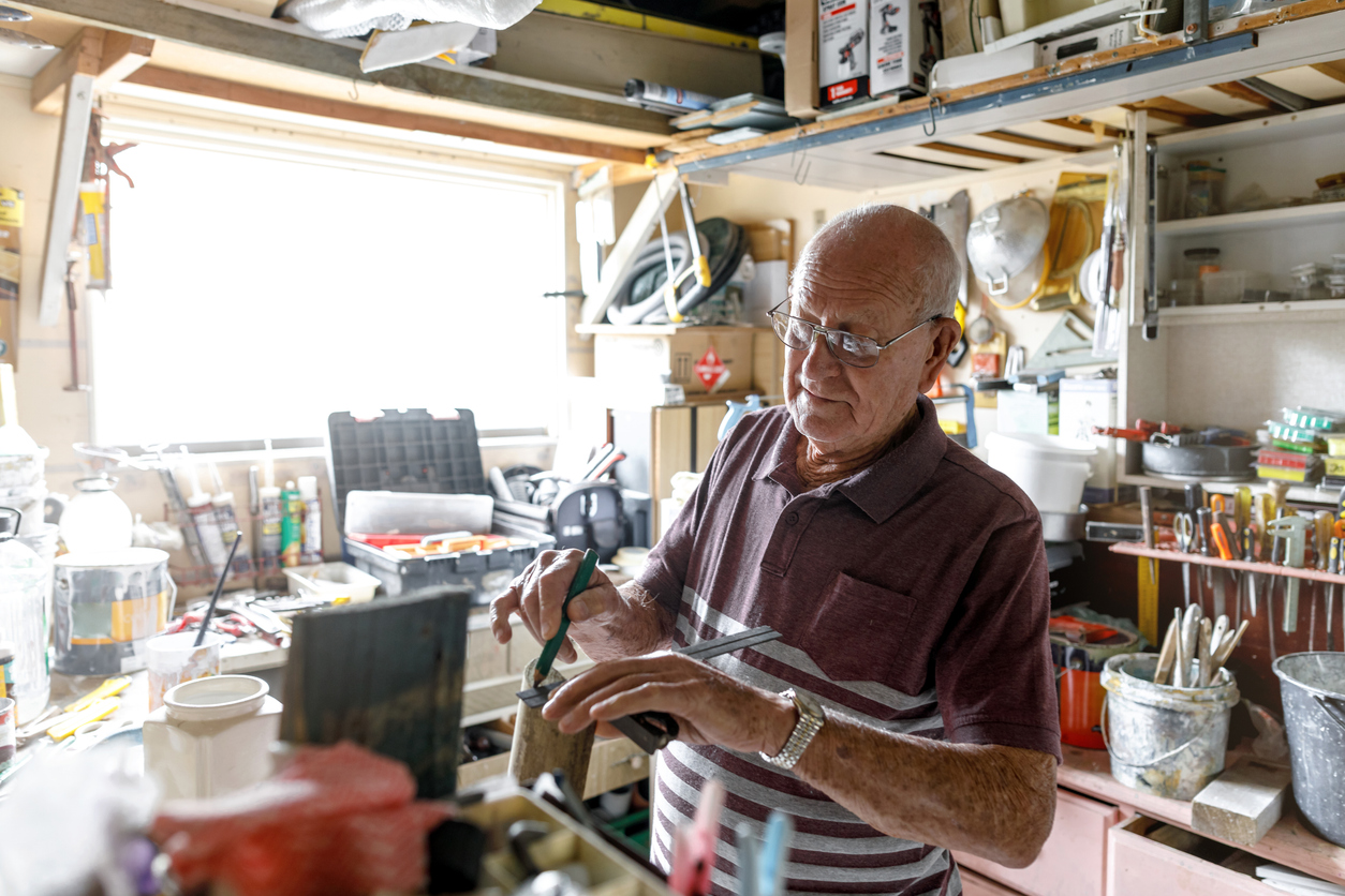 older-man-working-in-workshop-based-man-cave
